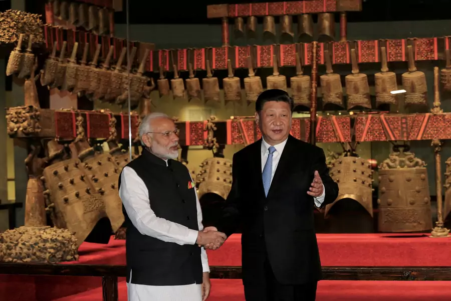 Indian Prime Minister Narendra Modi and Chinese President Xi Jinping shake hands at the inaugural informal summit in Wuhan, China, in 2018.