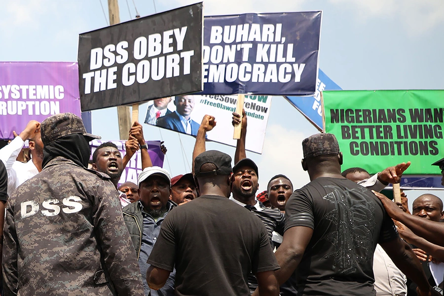 People demonstrate to demand the release of activist and opposition politician Omoyele Sowore, facing treason charges over calls for a "revolution" against the government, outside Department of State Security headquarters in Abuja, on November 12, 2019.