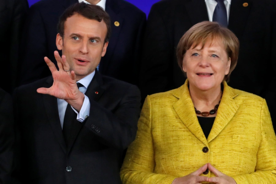 French President Emmanuel Macron and German Chancellor Angela Merkel take part in the launching of the Permanent Structured Cooperation (PESCO) during an EU summit in Brussels, Belgium, on December 14, 2017. 