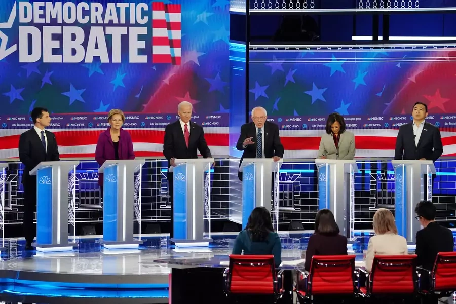 Presidential candidates listen to Senator Bernie Sanders speak at the fifth Democratic debate in Atlanta on November 20. 