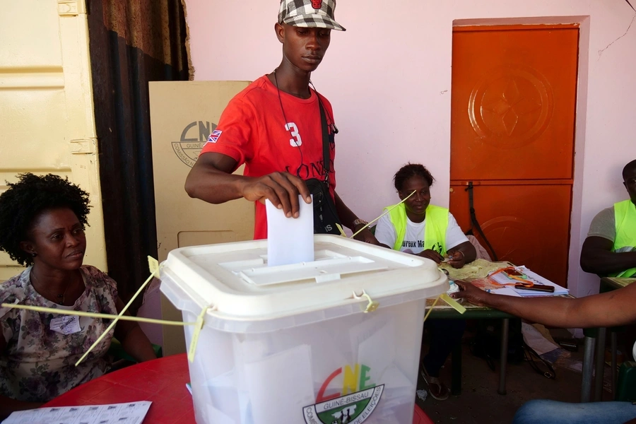 A man casts his ballot at a polling station during the presidential election in Bissau, Guinea-Bissau, on November 24, 2019. 