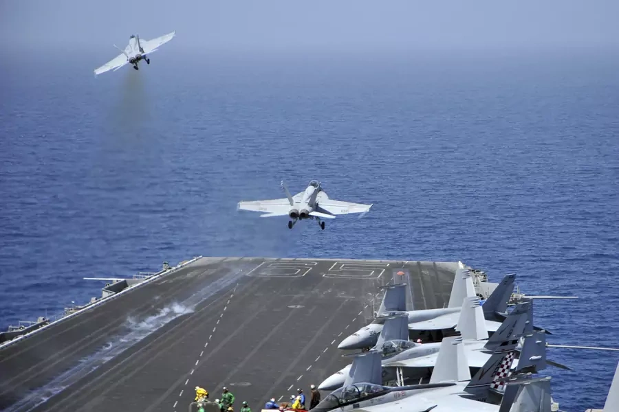 F/A-18F Super Hornets launch from the USS Enterprise in the Red Sea.