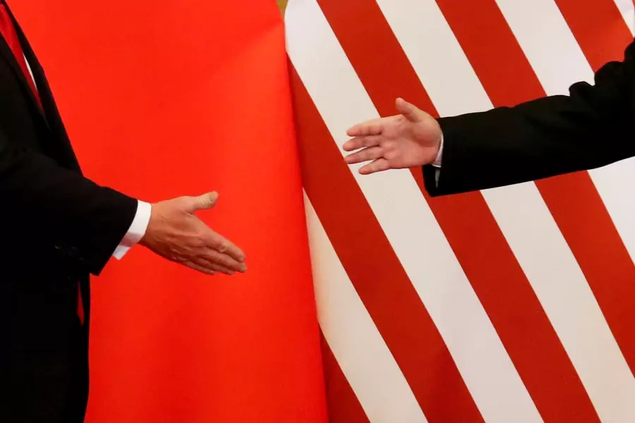 U.S. President Donald Trump and China's President Xi Jinping shake hands after making joint statements at the Great Hall of the People in Beijing, China