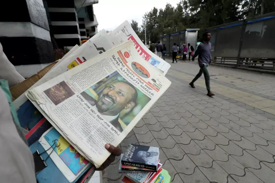A vendor sells a newspaper with a picture of Ethiopia’s Prime Minister, Abiy Ahmed on it's cover in Addis Ababa, Ethiopia, December 10, 2019.