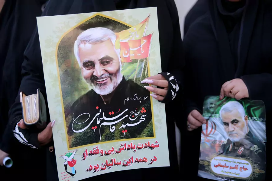 Women hold pictures of Iranian Major-General Qassem Soleimani, head of the elite Quds Force, who was killed in an air strike at Baghdad airport, during a funeral procession and burial at his hometown in Kerman, Iran, on January 7, 2020.