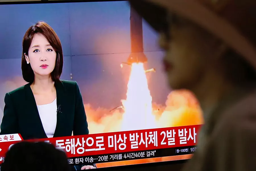 People watch a TV broadcast showing file footage for a news report in Seoul, South Korea, on October 31, 2019 on North Korea firing two projectiles, possibly missiles, into the sea between the Korean Peninsula and Japan. 