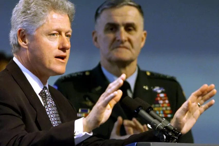 Then President Bill Clinton beside Gen. Hugh Shelton, then chairman of the Joint Chiefs of Staff, explaining the U.S. and NATO mission in Kosovo on April 1, 1999. Win McNamee/Reuters