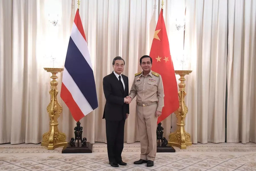 Chinese Foreign Minister Wang Yi (L) shakes hands with Thai Prime Minister Prayuth Chan-ocha (R) at Government House in Bangkok, Thailand on July 24, 2017.
