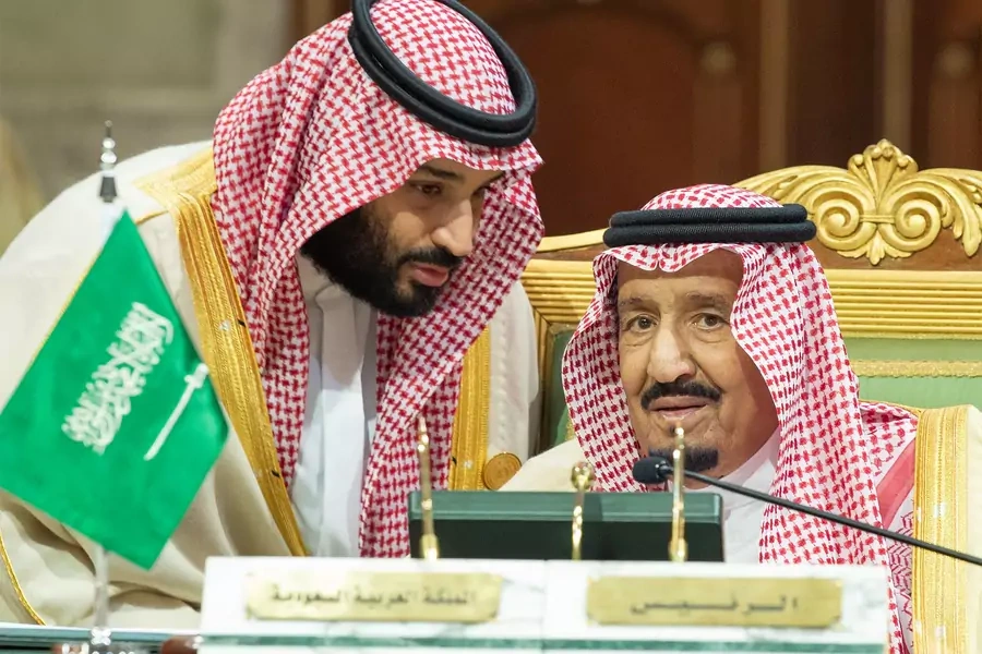 Saudi Crown Prince Mohammed bin Salman speaks to his father, King Salman bin Abdulaziz Al Saud, in December 2018. 