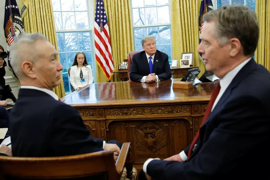 U.S. President Donald Trump looks on during a meeting with China's Vice Premier Liu He and U.S. Trade Representative Robert Lighthizer (R) in the Oval Office at the White House in Washington, U.S., February 22, 2019. 