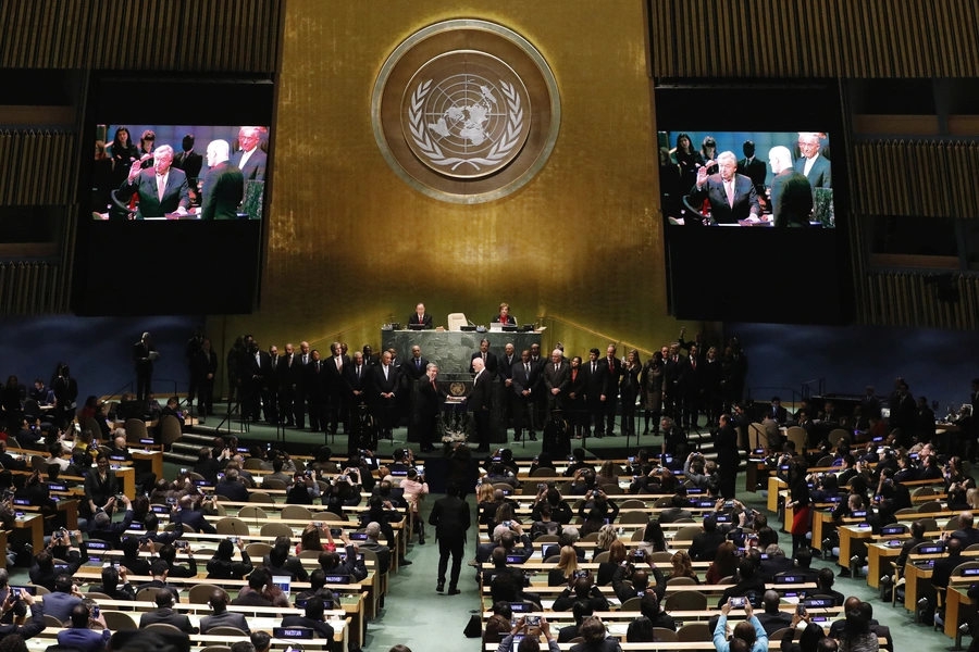 United Nations Secretary-General Ban Ki-moon (back L) watches as Secretary-General-designate Mr. Antonio Guterres of Portugal is sworn in by President of the U.N. General Assembly Peter Thomson (R), at UN headquarters in New York, U.S.