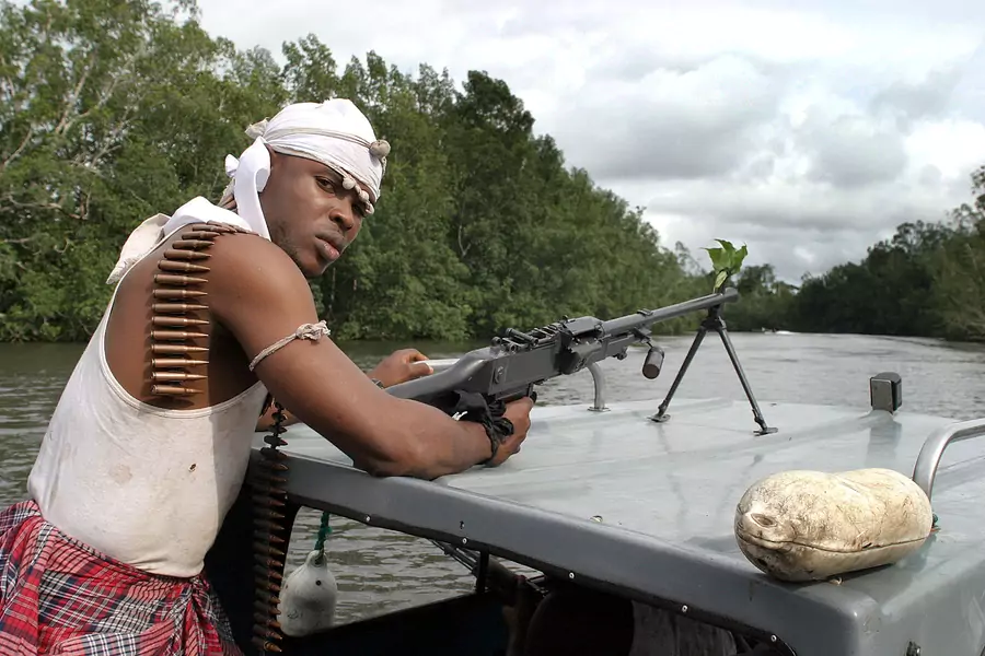 A Nigerian rebel of the Niger Delta People's Volunteer Force patrols the creeks of the Niger Delta near Port Harcourt in Nigeria, around the time of the Niger Delta uprising, on September 28, 2004.
