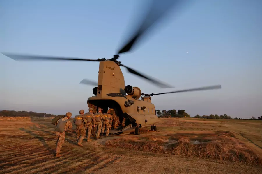 Members of South Korean and U.S. Special Forces enter a CH-47 Chinook during a joint military exercise conducted in Gangwon province, South Korea, on November 7, 2019. 