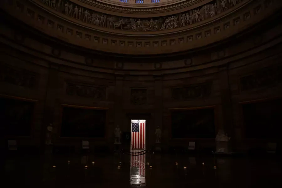 An American flag is illuminated in the empty U.S. Capitol rotunda in Washington, U.S. on January 24, 2020. 