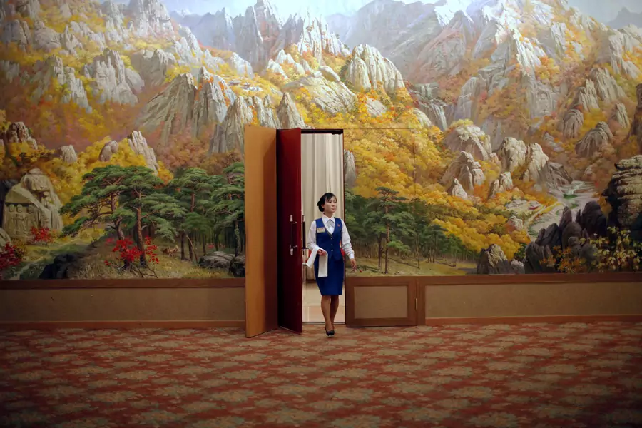 An employee enters a room at a hotel in Mount Kumgang resort in Kumgang, North Korea, on September 1, 2011.
