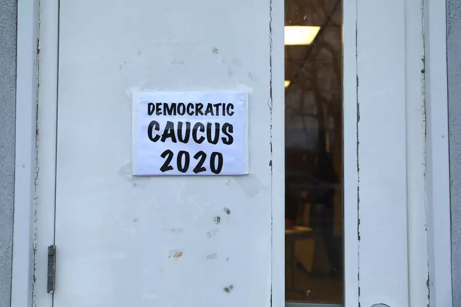 A sign is seen on a caucus doorway in Kellogg., Iowa, U.S.