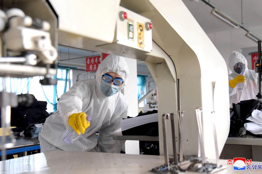 Volunteers carry out disinfection work during an anti-virus campaign in Pyongyang, North Korea in this image released by North Korea's Korean Central News Agency (KCNA) on March 4, 2020. 