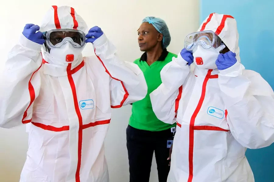 Kenyan nurses wear protective gear during a demonstration of preparations for any potential coronavirus cases at the Mbagathi Hospital, isolation center for the disease, in Nairobi, Kenya, on March 6, 2020.