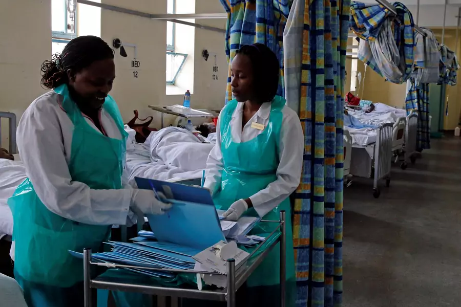 Medical practitioners organize records inside a ward set aside for cholera patients at the Kenyatta National Hospital in Nairobi, Kenya, on July 19, 2017.