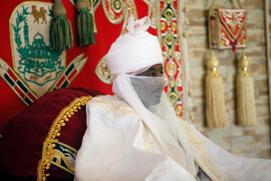 Emir of Kano at the time, Muhammad Lamido Sanusi II watches as local chiefs pay traditional homage, a day before the end of holy month of Ramadan, in Nigeria's northern city of Kano, July 5, 2016.