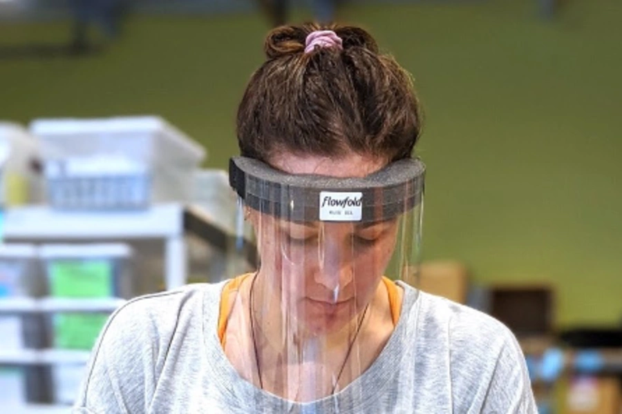 A worker at Flowfold using one of their newly designed masks on the production line.