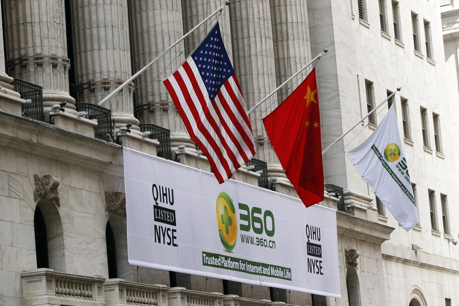 A sign advertising the Qihoo 360 Technology Co Ltd is hung with the U.S. and Chinese flags outside of the New York Stock Exchange before the company's Initial Public Offering (IPO).