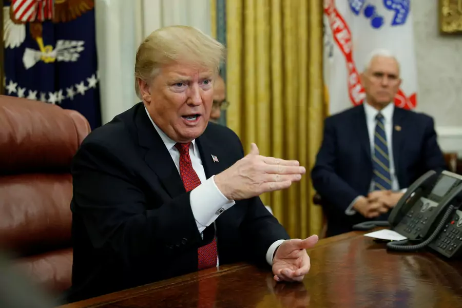 U.S. President Donald Trump speaks to China's Vice Premier Liu He as Vice President Mike Pence looks on during a meeting in the Oval Office of the White House on January 31, 2019.