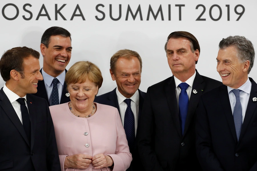 France's President Emmanuel Macron, Spain’s Prime Minister Pedro Sanchez, Germany’s Chancellor Angela Merkel, European Council President Donald Tusk, Brazil's President Jair Bolsonaro, and Argentina's President Mauricio Macri during a news conference.