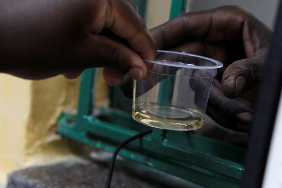 A recovering drug addict receives his dose of methadone at a Medication Assisted Therapy clinic run by Doctors Without Borders (MSF) at Karuri Level 4 hospital in Kiambu, Kenya, on October 3, 2019.