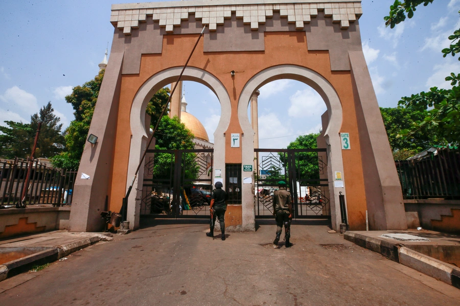 Two policemen are seen at the gate of the Abuja National Mosque, as the spread of the coronavirus disease (COVID-19) continues in Abuja, Nigeria, on March 27, 2020. Mainstream Islamic leaders ordered mosques to close a week before the government lockdown.