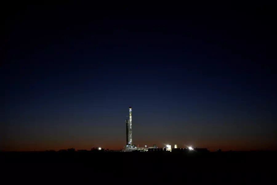 A horizontal drilling rig on a lease owned by Parsley Energy operates at sunrise in the Permian Basin near Midland, Texas U.S. August 24, 2018.