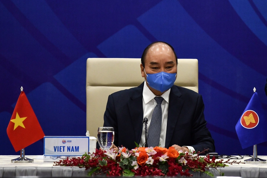 Vietnam's Prime Minister Nguyen Xuan Phuc waits for the start of a special video conference with leaders of the Association of Southeast Asian Nations (ASEAN) on the coronavirus disease (COVID-19), in Hanoi on April 14, 2020.