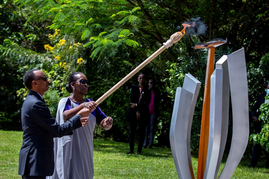 President Paul Kagame and First Lady Jeanette Kagame light the Rwandan genocide flame of hope, known as the "Kwibuka" (Remembering), to commemorate the 1994 Genocide at the Kigali Genocide Memorial Center in Kigali, Rwanda, on April 7, 2020. 