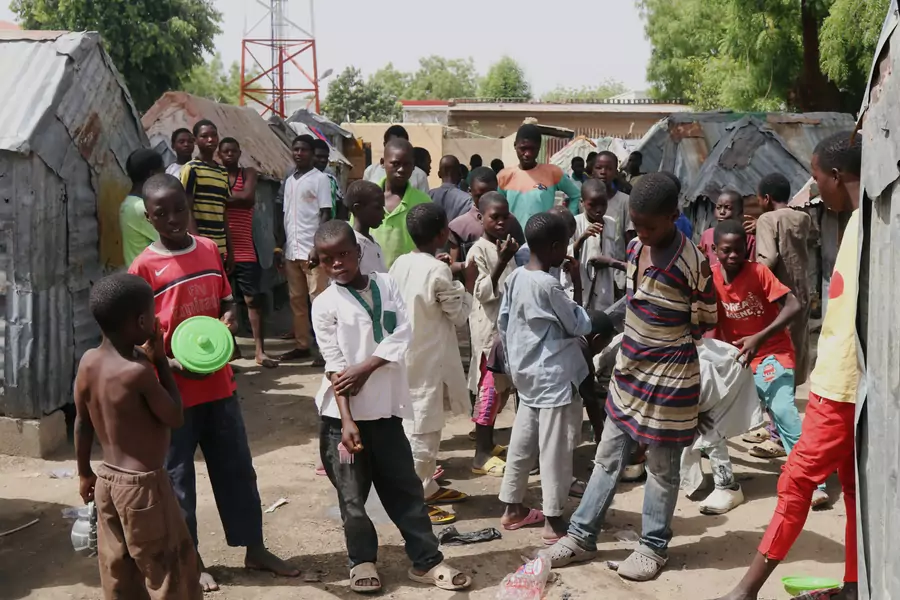 Students who attend Nigeria's Islamic schools, known as almajiris, gather in Tudunwada, as authorities struggle to contain coronavirus disease (COVID-19) in Maiduguri, Nigeria April 24, 2020.