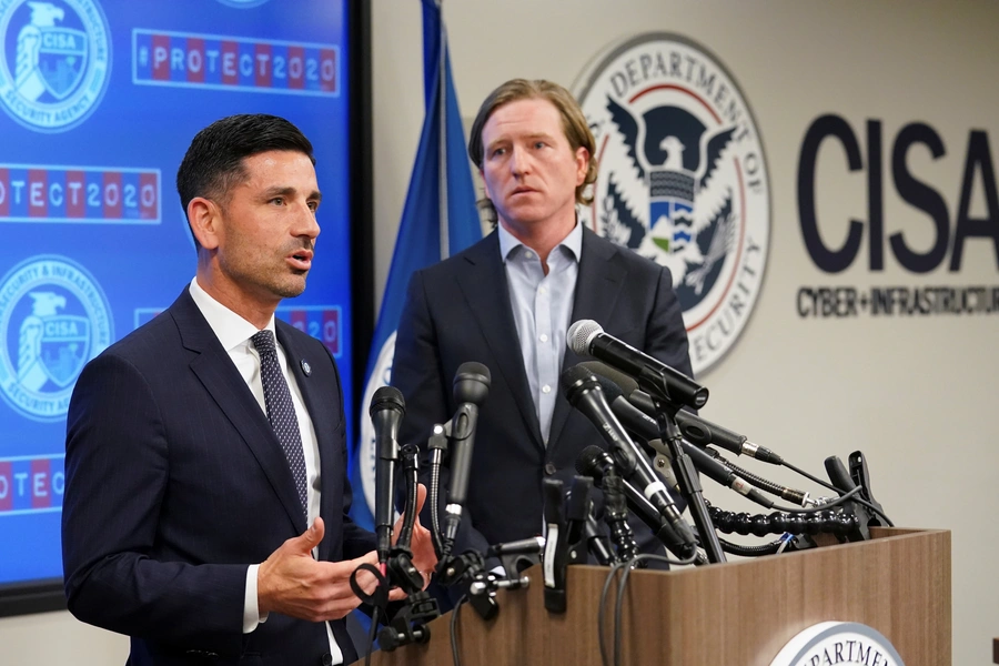 Department of Homeland Security (DHS) Acting Secretary Chad Wolf (L) and Cybersecurity and Infrastructure Security Agency (CISA) Director Christopher Krebs speak to reporters.