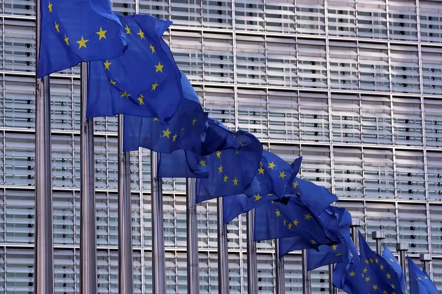 European Union flags fly outside the European Commission headquarters.