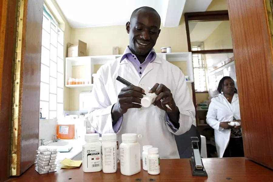 Michael Otieno, a pharmacist, dispenses antiretroviral (ARV) drugs at the Mater Hospital in Kenya's capital Nairobi, on September 10, 2015.