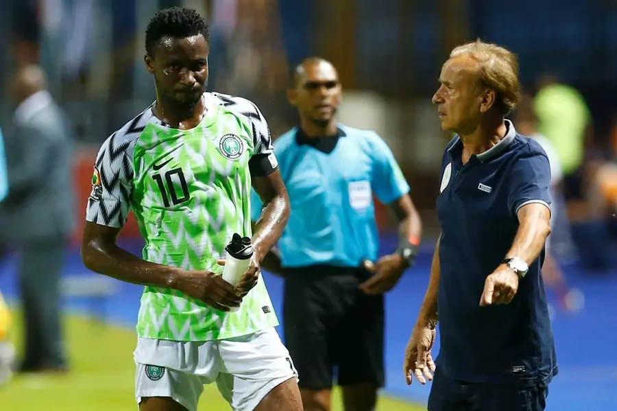 Nigeria's John Obi Mikel with coach Gernot Rohr at the Africa Cup of Nations on June 22, 2019. Mikel, the team's captain at the World Cup the year before, learned his father was kidnapped before Nigeria's last group stage match.