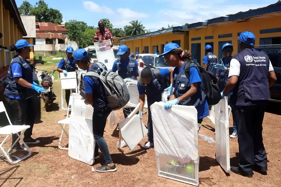 World Health Organization workers, during a 2018 Ebola outbreak, prepare a center for vaccination in the port city of Mbandaka, Democratic Republic of Congo, on May 21, 2018.
