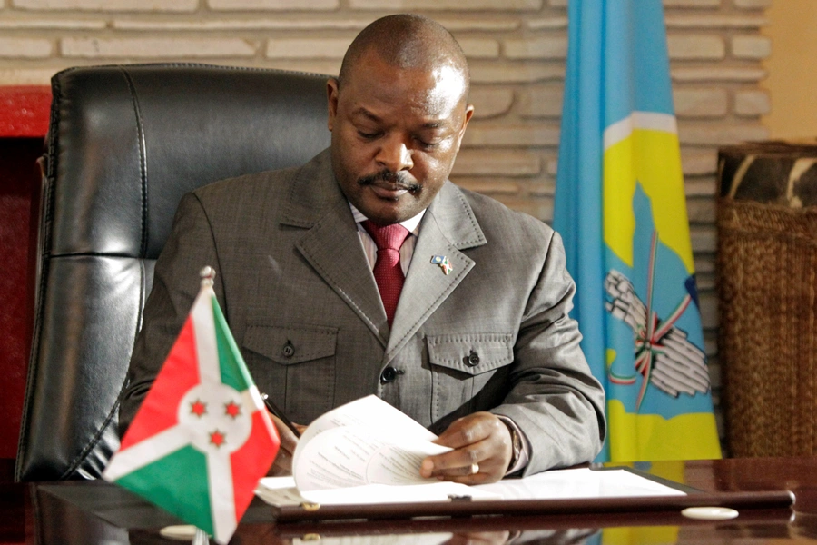 Burundi's President Pierre Nkurunziza signs the new constitution at the presidential palace in Gitega Province, Burundi June 7, 2018