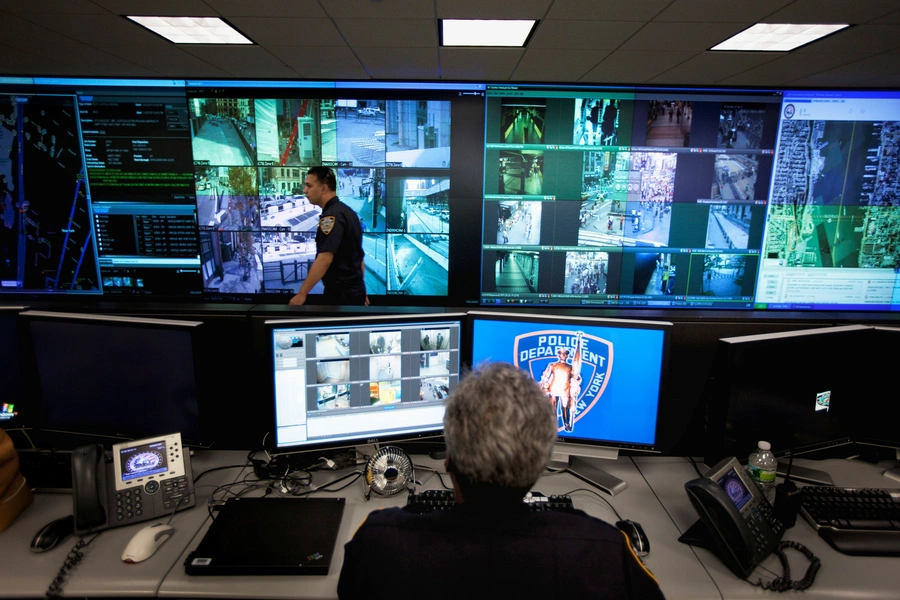 A New York Police Department officer watches video feeds in the Lower Manhattan Security Initiative facility in New York September 1, 2011.