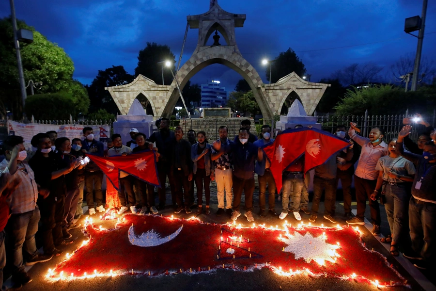 People celebrate in Kathmandu after Nepal's parliament approved a new map of the country.