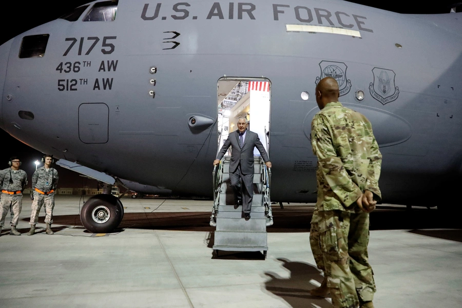 Former U.S. Secretary of State Rex Tillerson steps off a plane at an air base in Qatar, on October 24, 2017.