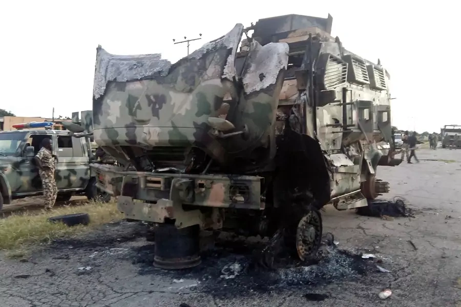 A damaged military vehicle is pictured in the northeast town of Gudumbali, after an attack by members of Islamic State in West Africa (ISWA), Nigeria September 11, 2018.