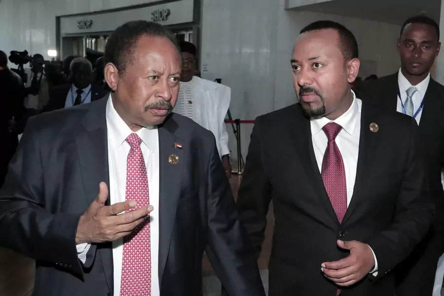 Sudan's Prime Minister Abdalla Hamdok and Ethiopia's Prime Minister Abiy Ahmed arrive for the opening of the 33rd Ordinary Session of the Assembly of the Heads of State and the Government of the African Union in Addis Ababa, Ethiopia, February 9, 2020