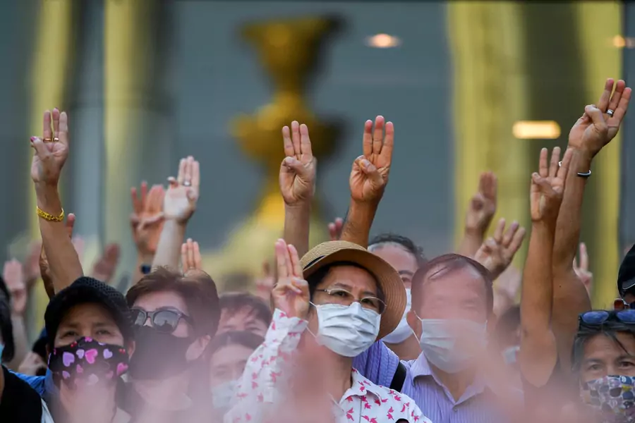 Protesters raise their hands during a protest demanding the resignation of the government, defying the coronavirus disease (COVID-19) restrictions on large gatherings in one of the largest demonstrations since a 2014 army coup in Bangkok, Thailand on July