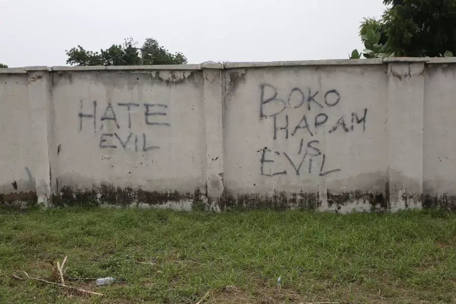 Writings describing Boko Haram are seen on the wall along a street in Bama, in Borno, Nigeria, on August 31, 2016.