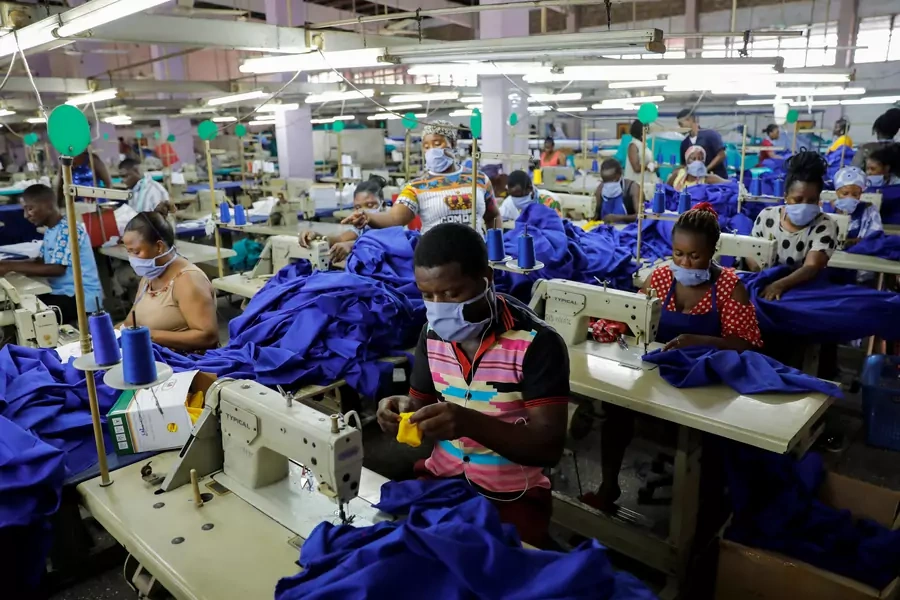 Workers of a local factory begin the production of personal protective gear for local frontline health workers as commissioned by the government, during the partial lockdown in Accra to slow the spread of the COVID-19, in Accra, Ghana. April 10, 2020