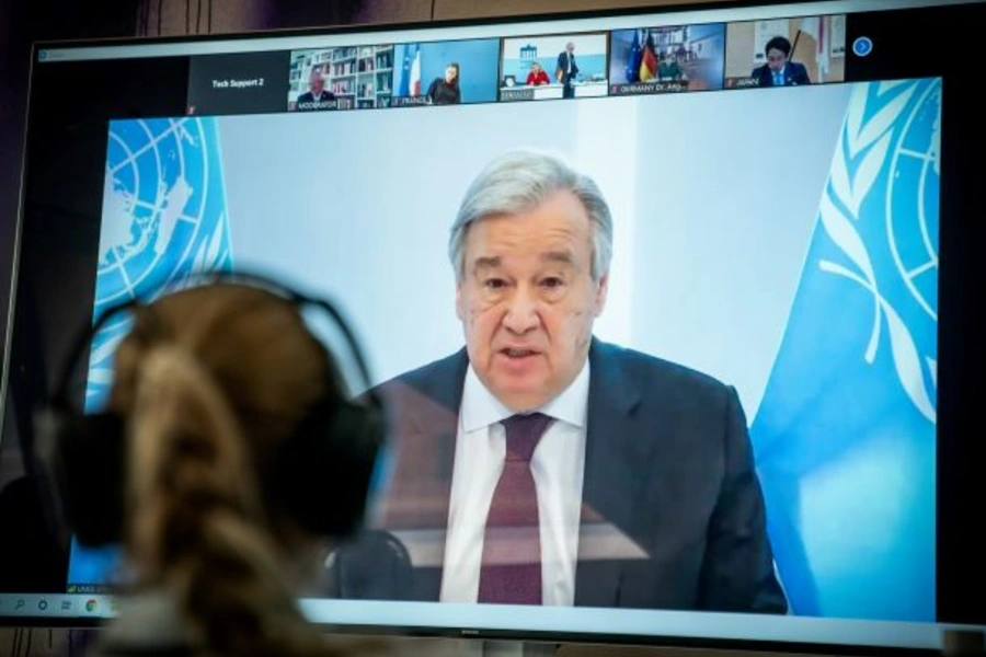 United Nations Secretary-General Antonio Guterres is seen on a video screen during a virtual climate summit in Berlin on April 28, 2020. 