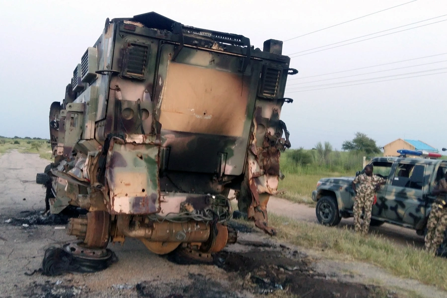 A damaged military vehicle is pictured in the northeast town of Gudumbali, after an attack by members of Islamic State in West Africa (ISWA), on September 11, 2018.